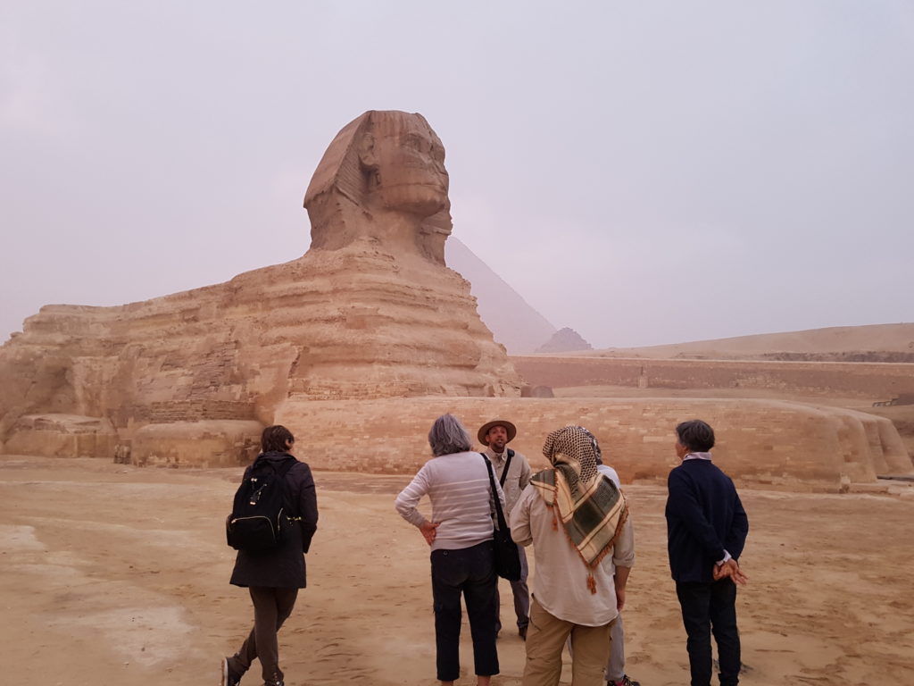 Holidays Egypt group at the sphinx with egyptologist guide